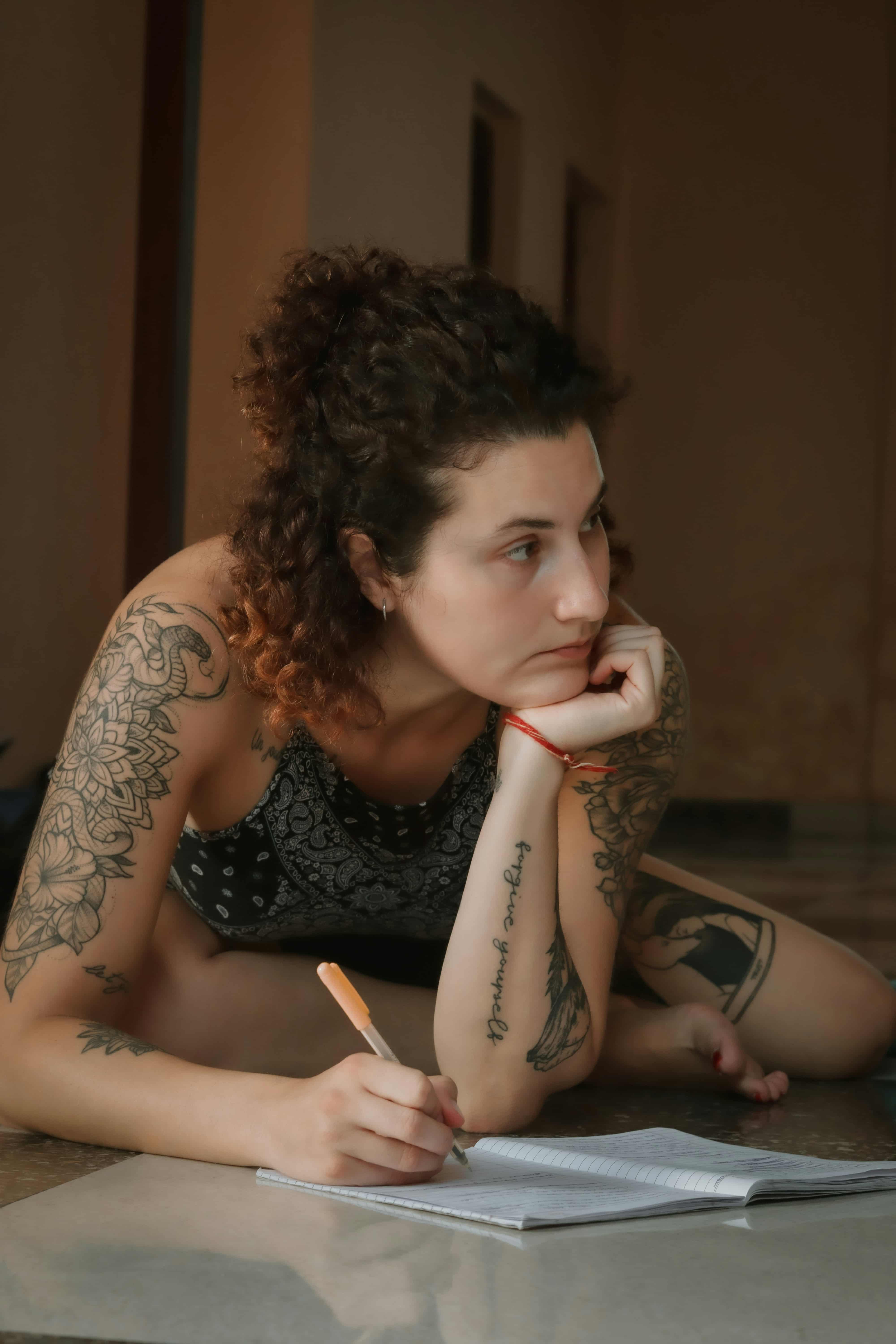 A student researching yoga schools before booking
